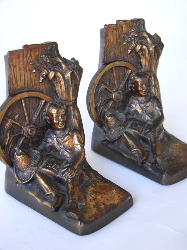 A pair of vintage Huckleberry Finn bookends circa 1960